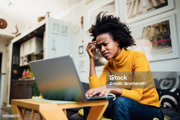 African American Woman Working From Home Stock Photo - Download Image Now - One Woman Only, Displeased, Laptop