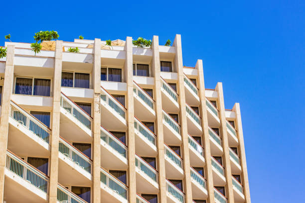 Tel Aviv-Yafo, Israel - June 6, 2018: Facade view of the Hilton Tel Aviv Hotel at the Tel Aviv beach. The building reflects the mid-century modern, modernist style.