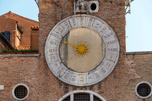 Close up clock and bell tower in Venice