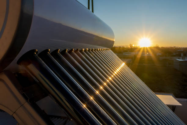 solar hot water tank at sunset solar hot water tank at sunset solar heater stock pictures, royalty-free photos & images