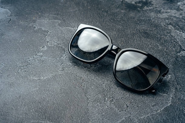 istock Dark male sunglasses on grey concrete surface 1292490264