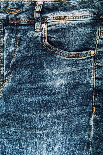 istock Jeans denim fabric texture seam Blue jeans background 1292492208