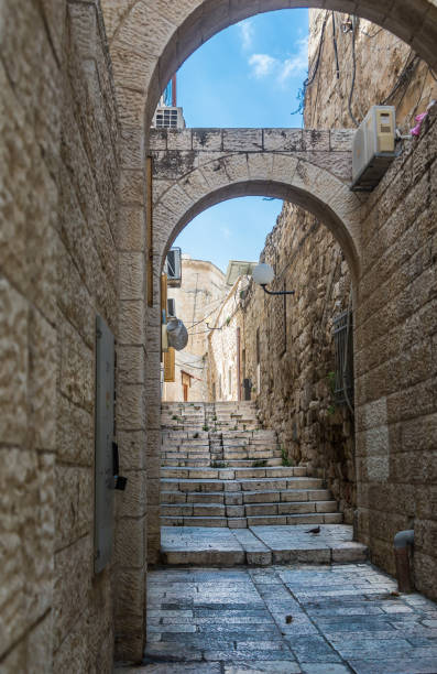 istock Dramatic view of typical street inside walls of Jerusalem . 1292493445