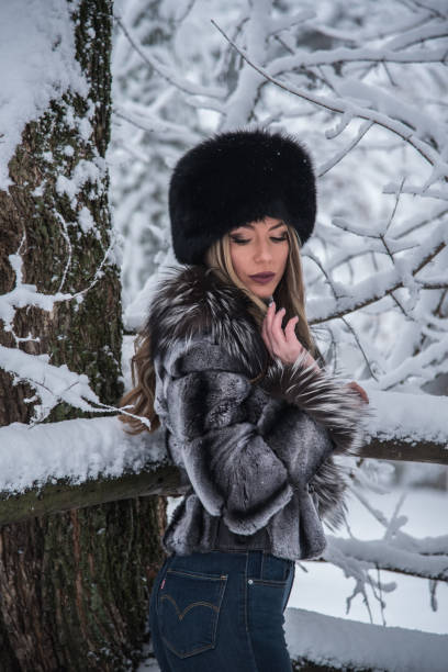 istock A beautiful girl posing on a snowy mountain 1292493619