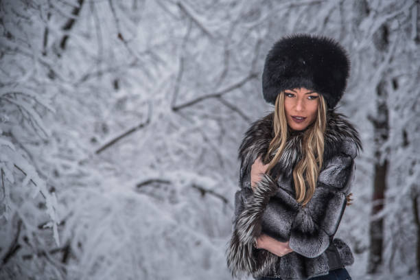 istock A beautiful girl posing on a snowy mountain 1292493715