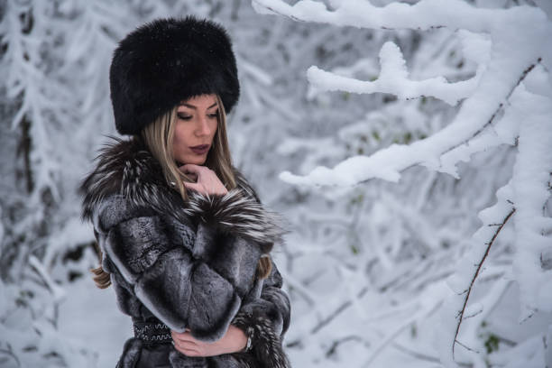 istock A beautiful girl posing on a snowy mountain 1292494281