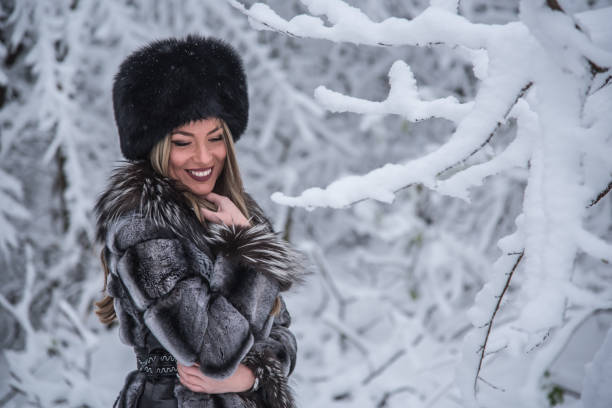 istock A beautiful girl posing on a snowy mountain 1292494282