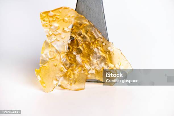 Cannabis Oil Concentrate Aka Shatter Isolated Over White Stock Photo - Download Image Now