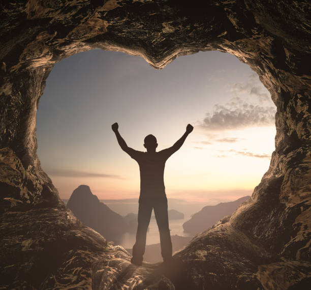 Alone man standing on cave of heart