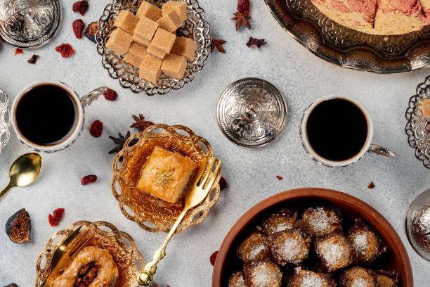 istock Cup of coffee and turkish pastries on dark surface 1292495169