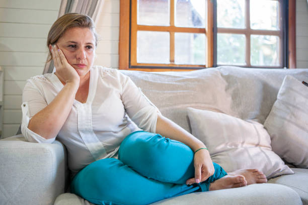 istock Woman with depression at home 1292497405