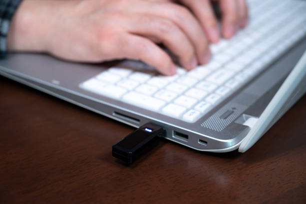 istock The hand of a person using a USB memory. Cyber Information Protection Concept. 1292497426