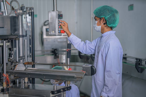 istock industrial background of asian food and beverage worker controling processing line control panel 1292500928