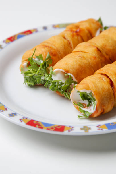 istock Crunchy rolls stuffed with cream cheese 1292502610