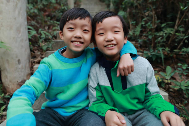 istock Happy Chinese boy playing in a park 1292503372