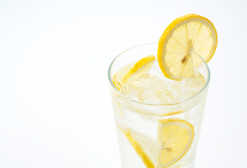 Lemon sour in a glass on a white background with copy space