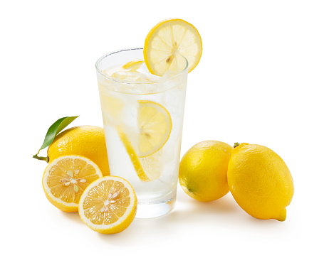 Lemons on a white background and lemon sour in a glass