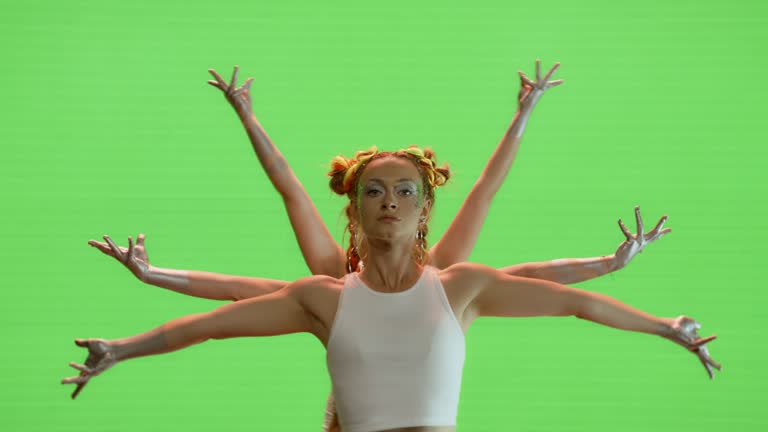 Synchronized break dancers performing together on green background