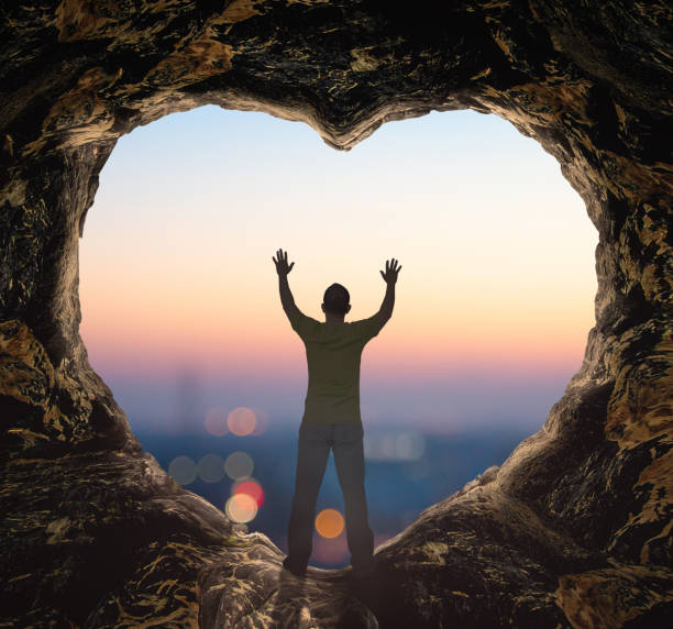istock Alone man standing on cave of heart 1292505699