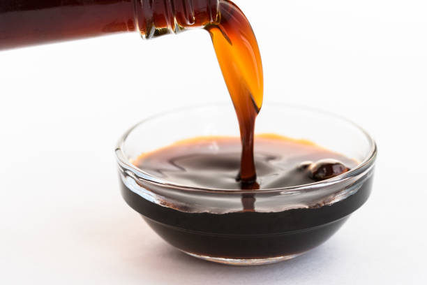 istock Pouring Coconut Aminos into a Bowl 1292506588