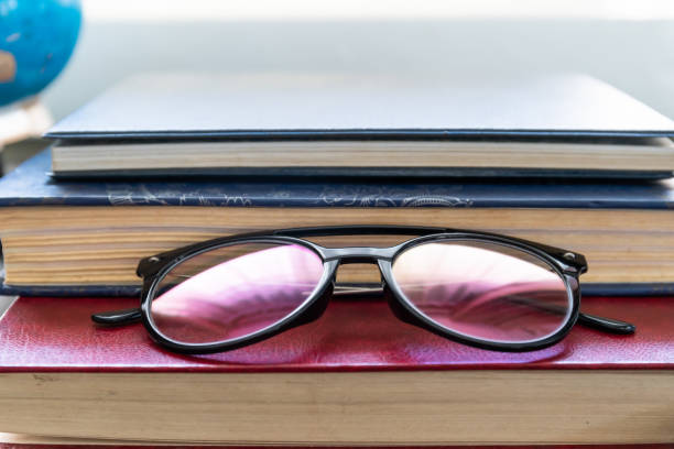 istock Reading glasses put on hardcover books 1292508927