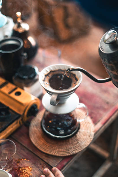 istock Drip coffee, barista pouring water on coffee ground with filter,brewing coffee 1292514932