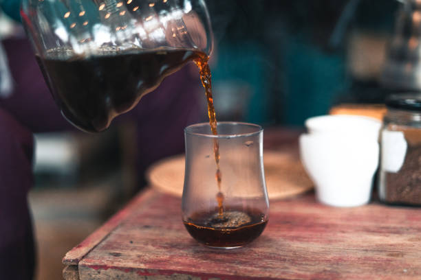 istock Drip coffee, barista pouring water on coffee ground with filter,brewing coffee 1292514933