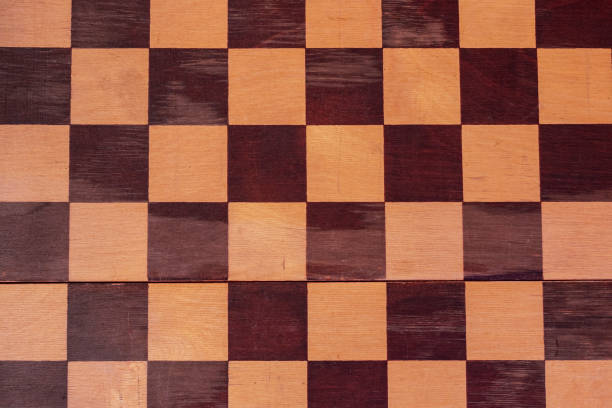 istock The surface of an old checkerboard. 1292515046
