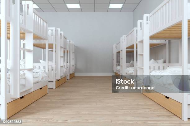 Modern College Dorm Room With Messy Bunk Beds And Parquet Floor Stock Photo - Download Image Now