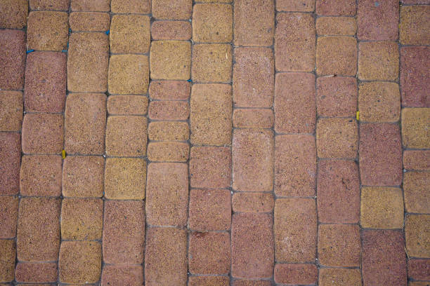 istock background stone pavement. road paved with cobbles. texture of bricks. 1292526523