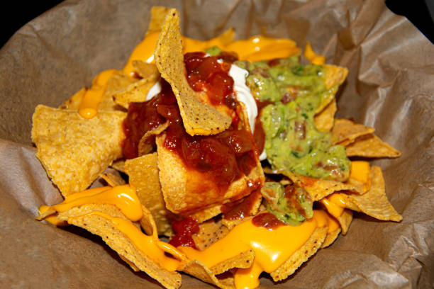 istock Nacho meal plate with tomato, cheese and guacamole 1292526620