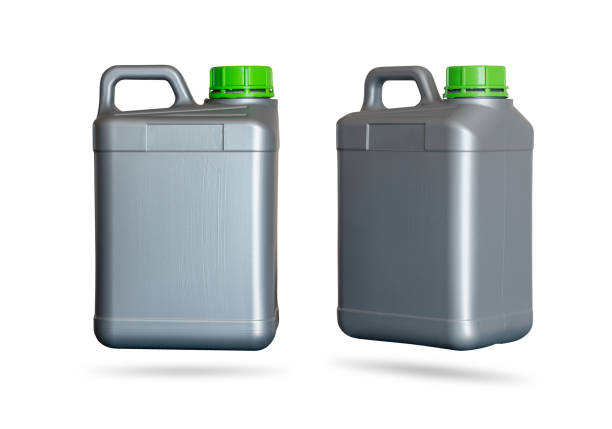 istock Gray plastic jerrycan with green lid standing sideways and diagonally on white background. 1292530442