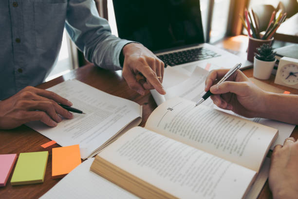 istock Teenager studying at desk and doing homeworks 1292530810
