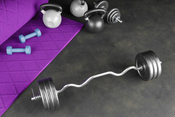 istock Sport background with copyspace. Top view of grey dumbbells ,black kettlebell and workout gloves. Weight lifting exercise concept.3d illustration 1292531952