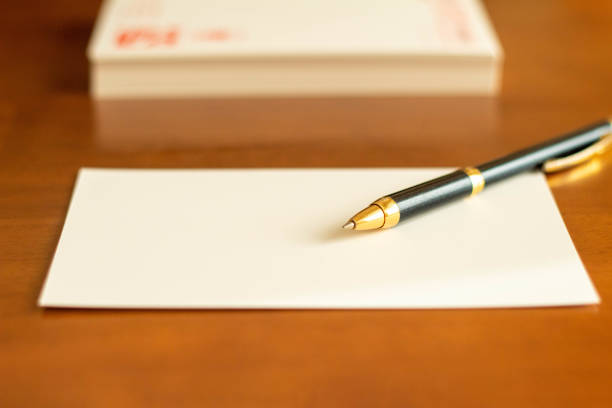 New Year's card and ballpoint pen placed on the desk