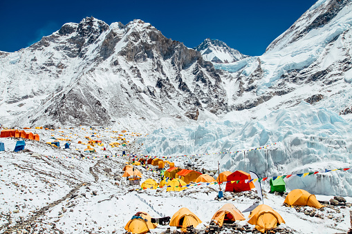 Bright yellow tents in Mount Everest Base Camp, Khumbu glacier and mountains, Nepal, Himalayas