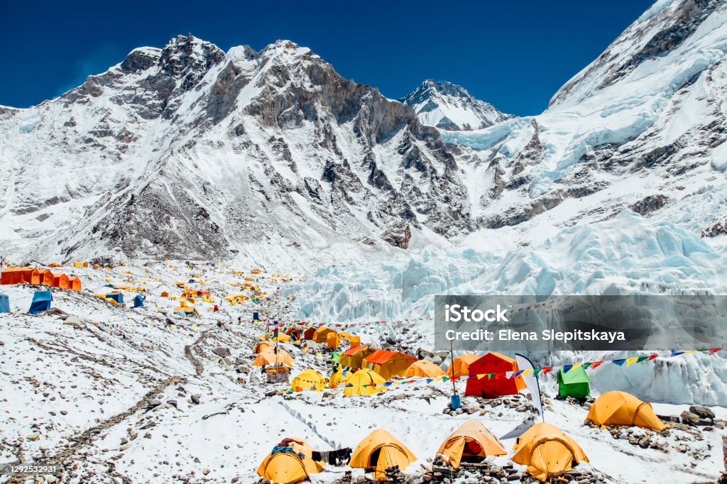 Bright yellow tents in Mount Everest Base Camp, Khumbu glacier and mountains, Nepal, Himalayas Bright yellow tents in Mount Everest Base Camp, Khumbu glacier and mountains, Sagarmatha national park, Nepal, Himalayas Mt. Everest Stock Photo