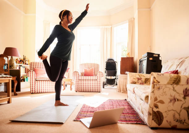 istock Woman exercising at home during pandemic 1292533059