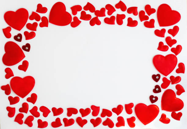 istock Frame of red hearts with space for text the centre on white background. Flat lay, top view Valentines Day background love concept. 1292533878