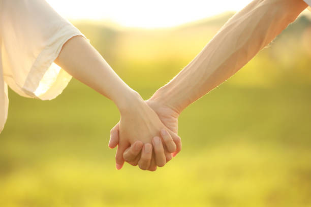Connected hands Connected hands couple holding hands stock pictures, royalty-free photos & images