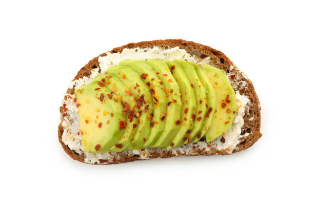 istock Delicious toast with avocado isolated on white background 1292534739