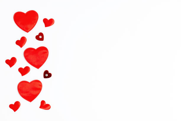 istock Frame of red hearts with space for text the centre on white background. Flat lay, top view Valentines Day background love concept. 1292535166