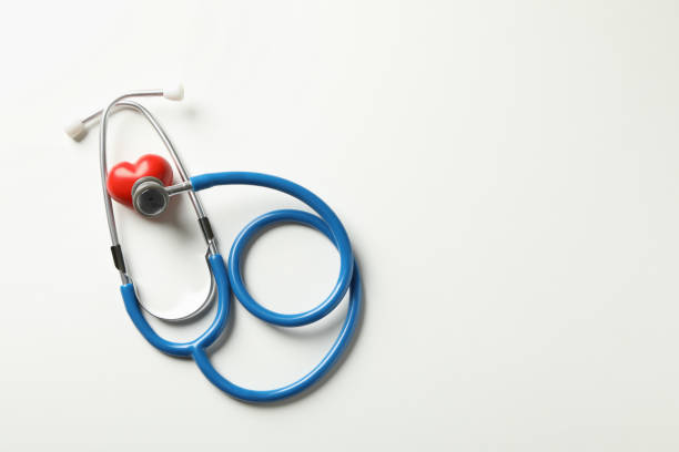 istock Blue stethoscope and heart on white background 1292539458