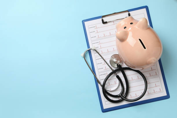 istock Medical concept with clipboard with electrocardiogram on blue background 1292540085