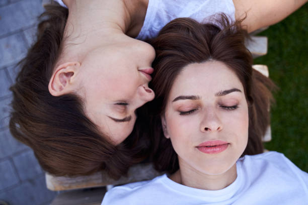 Top view of ladys lying on the bench