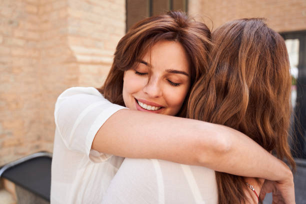 istock Lady hugs his sister carefully 1292540307