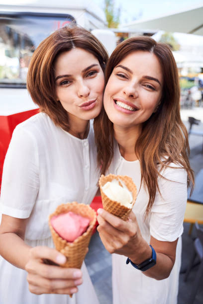 istock Two best friends standing check to check with each other 1292540319