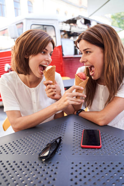 istock Females eating ice cream at the cafe 1292540335