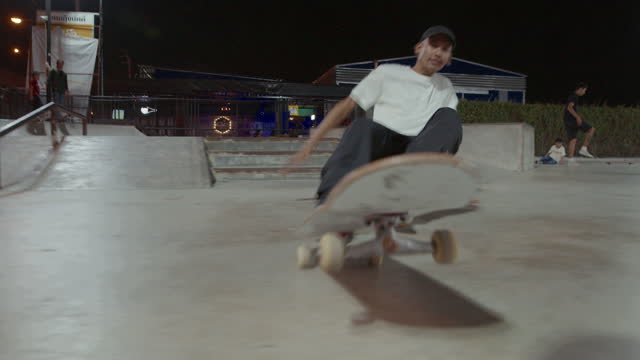 Asian skateboarder with stressful moments.