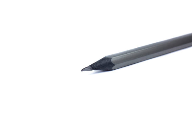 istock Grey pencil on white background. Close up photo. 1292541248